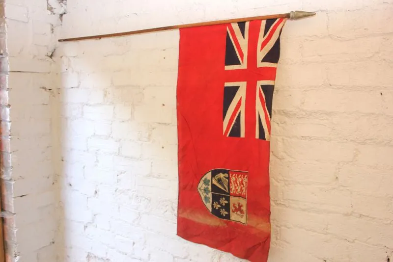 A Good British Empire Early 20thC Canadian Red Ensign Flag Mounted on a Pole